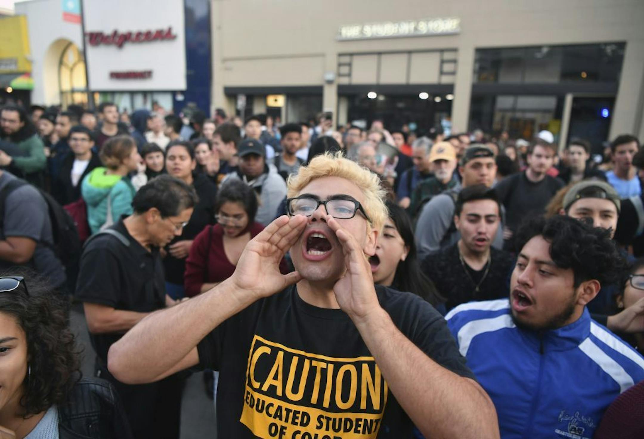 Victor Gonzales shouts with a crowd before a speaking engagement by Ben Shapiro on the campus of the University of California Berkeley in Berkeley, Calif., Thursday, Sept. 14, 2017. Several streets around the University of California, Berkeley, were closed off Thursday with concrete and plastic barriers ahead of an evening appearance by the conservative commentator � the latest polarizing event to raise concerns of violence on the famously liberal campus.