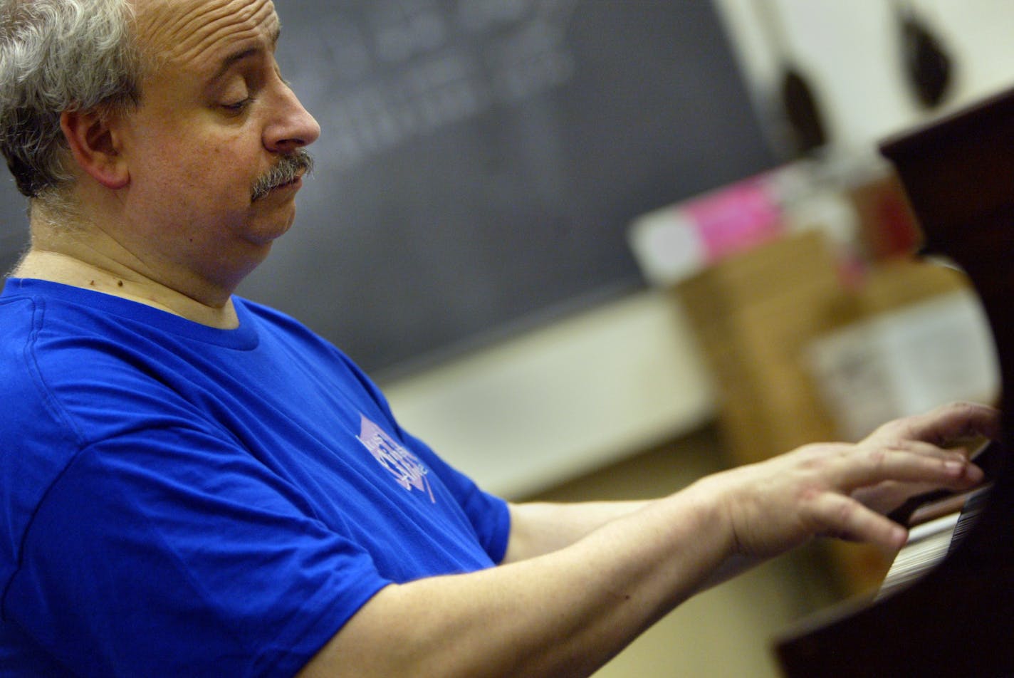 David Haas is a musician from Eagan who writes church music. He plays the piano at St. Kate's for a photo Thursday. Stribsouth RenÈe Jones/Star Tribune 7/15/04