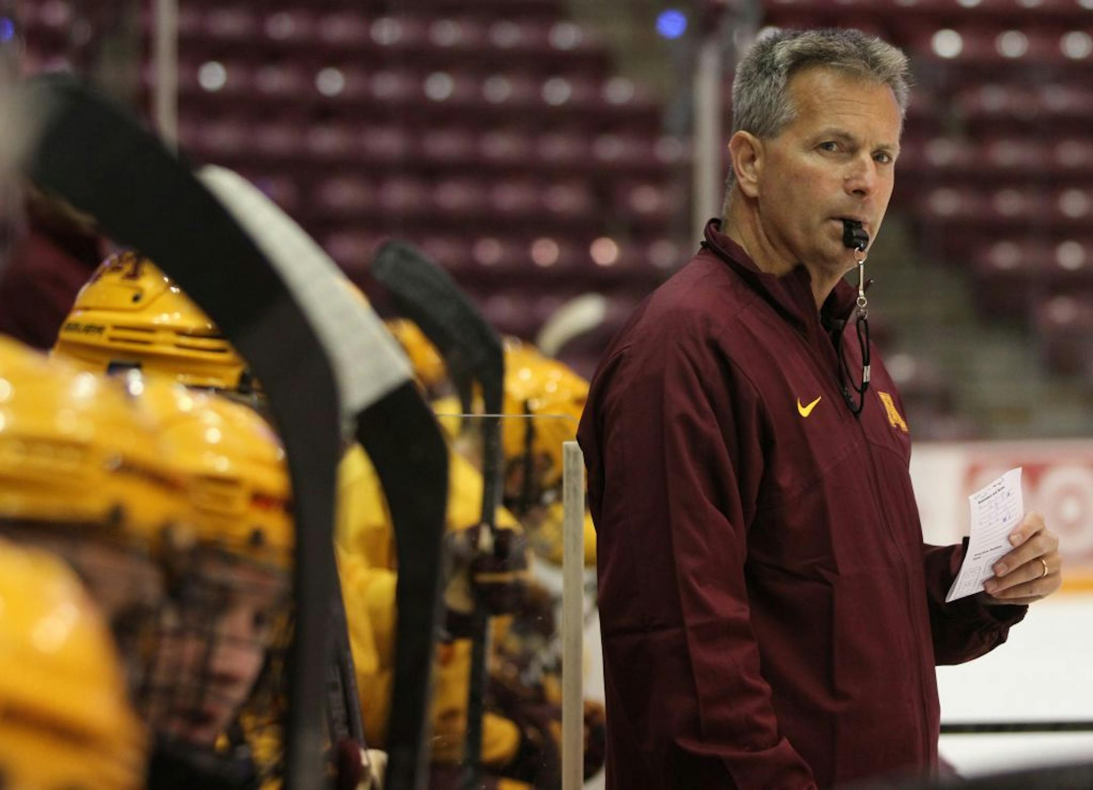 Don Lucia, Gopher Head Hockey Coach, ran drills from the bench during hockey practice at Mariucci Arena on 10/2/13