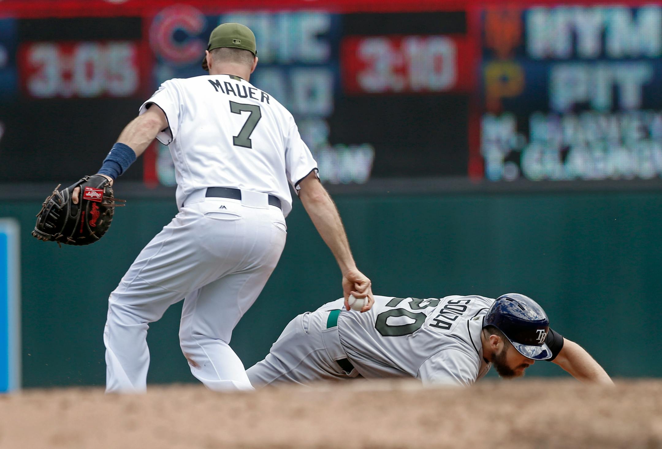 Tampa Bay Rays' Steven Souza Jr., right, falls he is tagged out on a rundown between first and second by Minnesota Twins first baseman Joe Mauer in the fourth inning of a baseball game Sunday, May 28, 2017 in Minneapolis. (AP Photo/Jim Mone)