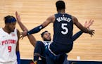 Minnesota Timberwolves guard Malik Beasley (5) raced to help up forward Josh Okogie (20) after he landed on the floor after making a shot in the fourt