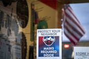A sign outside the True Value hardware store in downtown Spring Grove reminded people to wear masks. ] LEILA NAVIDI • leila.navidi@startribune.com B