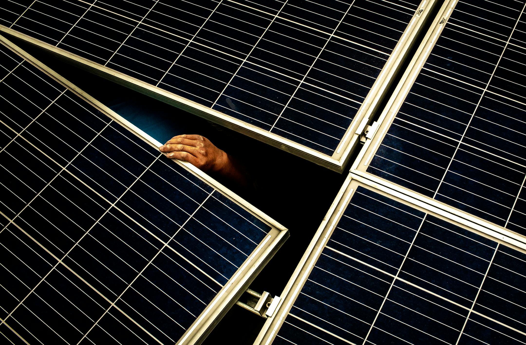 A worker installs solar panels on a 47-story residential development in Wuhan in the Hubei province of China, June 5, 2018. The West was sure the Chinese approach would not work. It just had to wait. It’s still waiting. (Bryan Denton/The New York Times)