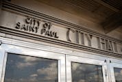 A split St. Paul City Council is moving forward with a plan to ban smoking in city parks and near certain building entrances, as city leaders continue