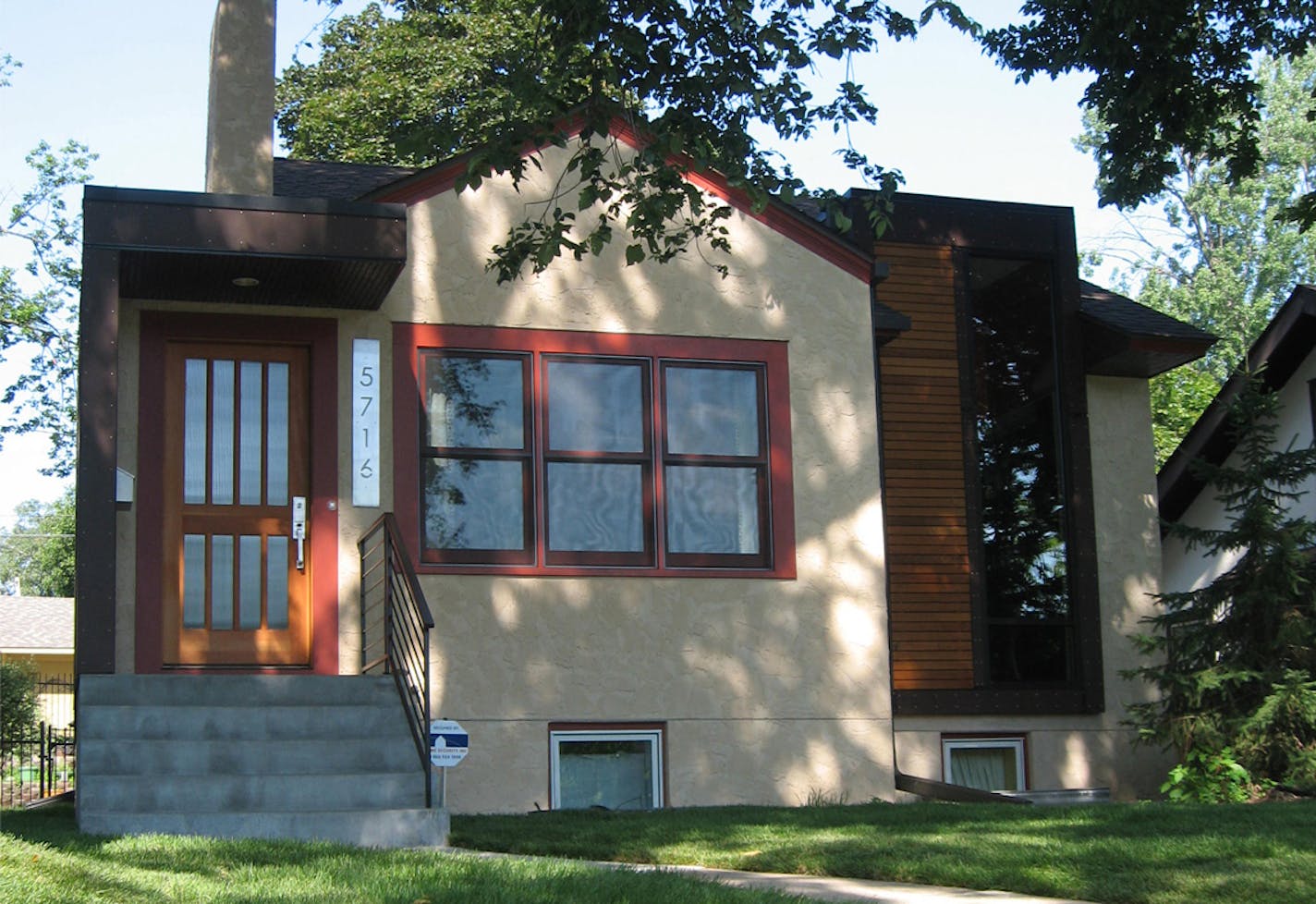 Architect Jackie Millea designed a modern update of her home in south Minneapolis so that the front would blend in with the neighborhood, while the bulk of the addition bumped out of the back.