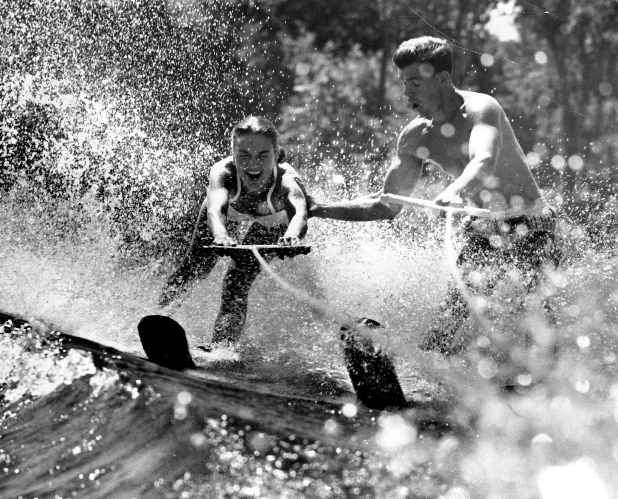 July 31, 1952: Minneapolis Aquatennial Queen of the Lakes Joanne Melherg served notice Wednesday that she will be a real aqua queen. With the help of water skiing instructors Frank Beddor and Si Reedy, Joanne mastered the Mater of Cedar lake as she took her first water skiing lesson.