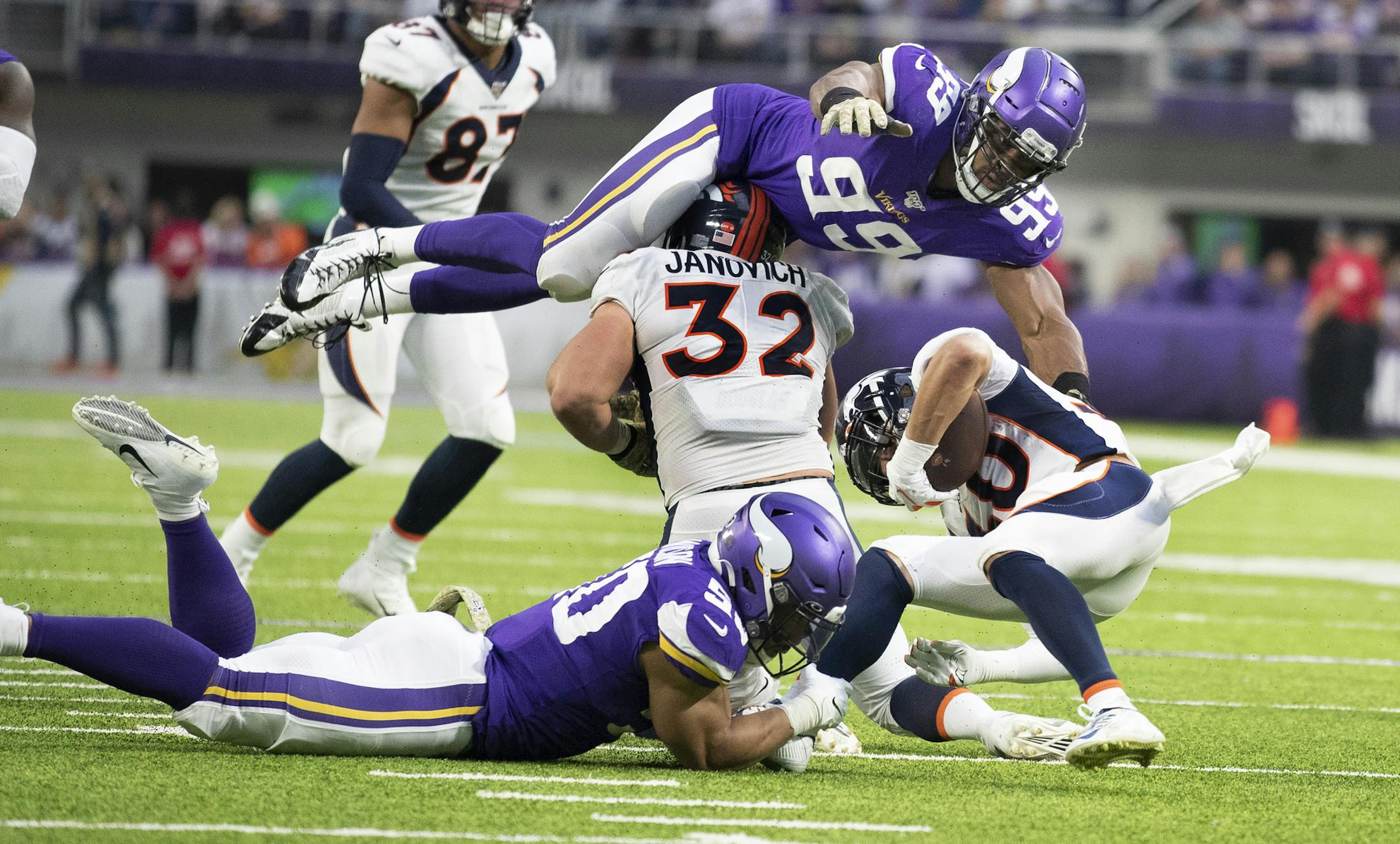 Vikings defensive end Danielle Hunter (99) and linebacker Eric Wilson (50) stopped Broncos running back Phillip Lindsay for no gain in the first half at U.S. Bank Stadium on Sunday. The Vikings have a bye week before diving into the remaining five games of the regular season.