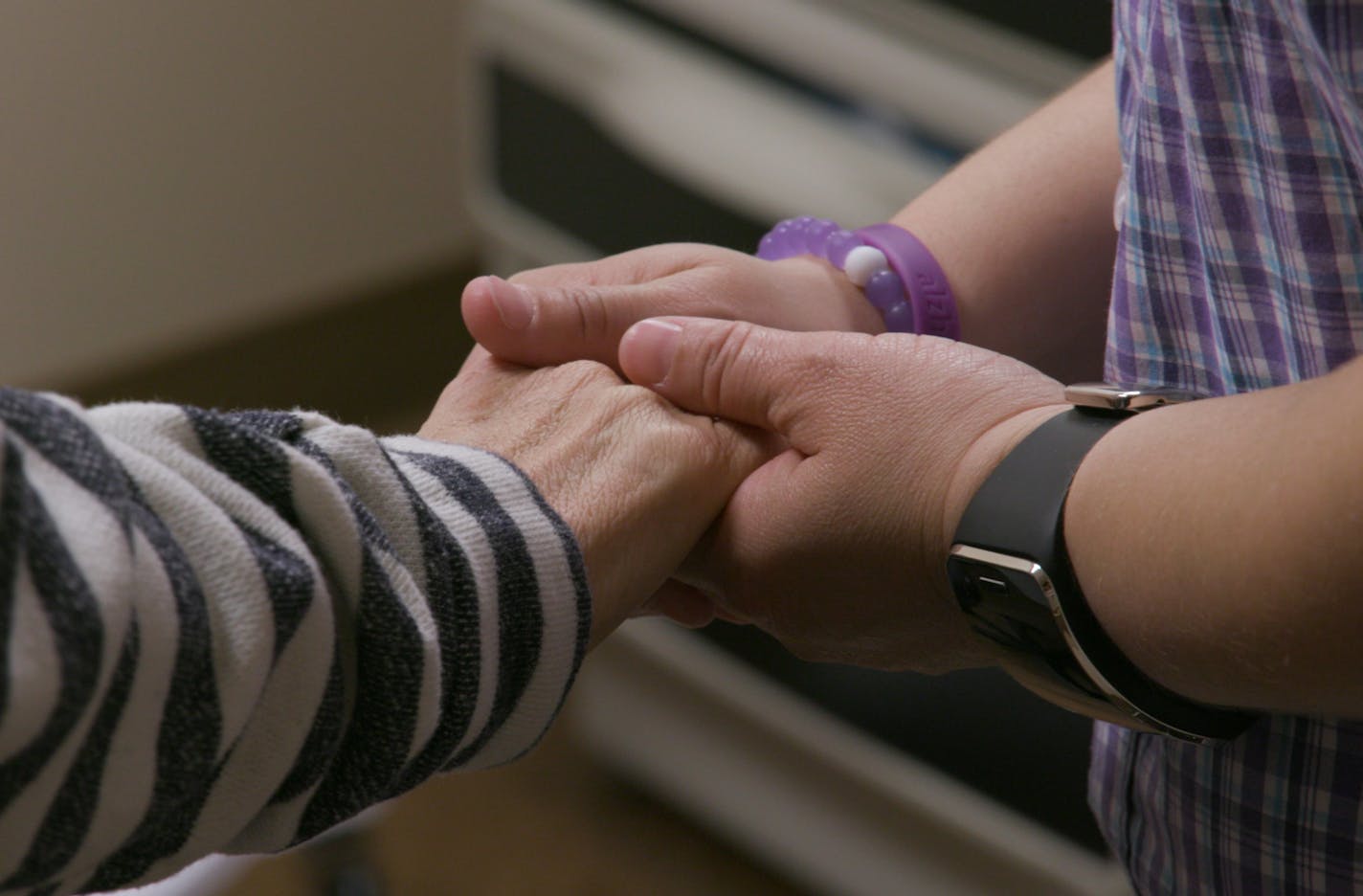 Daisy Duarte holds her mother Sonia&#xed;s hand. Sonia has a genetic form of early-onset Alzheimer&#xed;s and Daisy carries the same gene. Photo by PBS