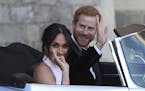The newly married Duke and Duchess of Sussex, Meghan Markle and Prince Harry, leave Windsor Castle in a convertible car after their wedding in Windsor