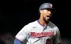 Byron Buxton hit a long home run and walked twice in a strong debut.