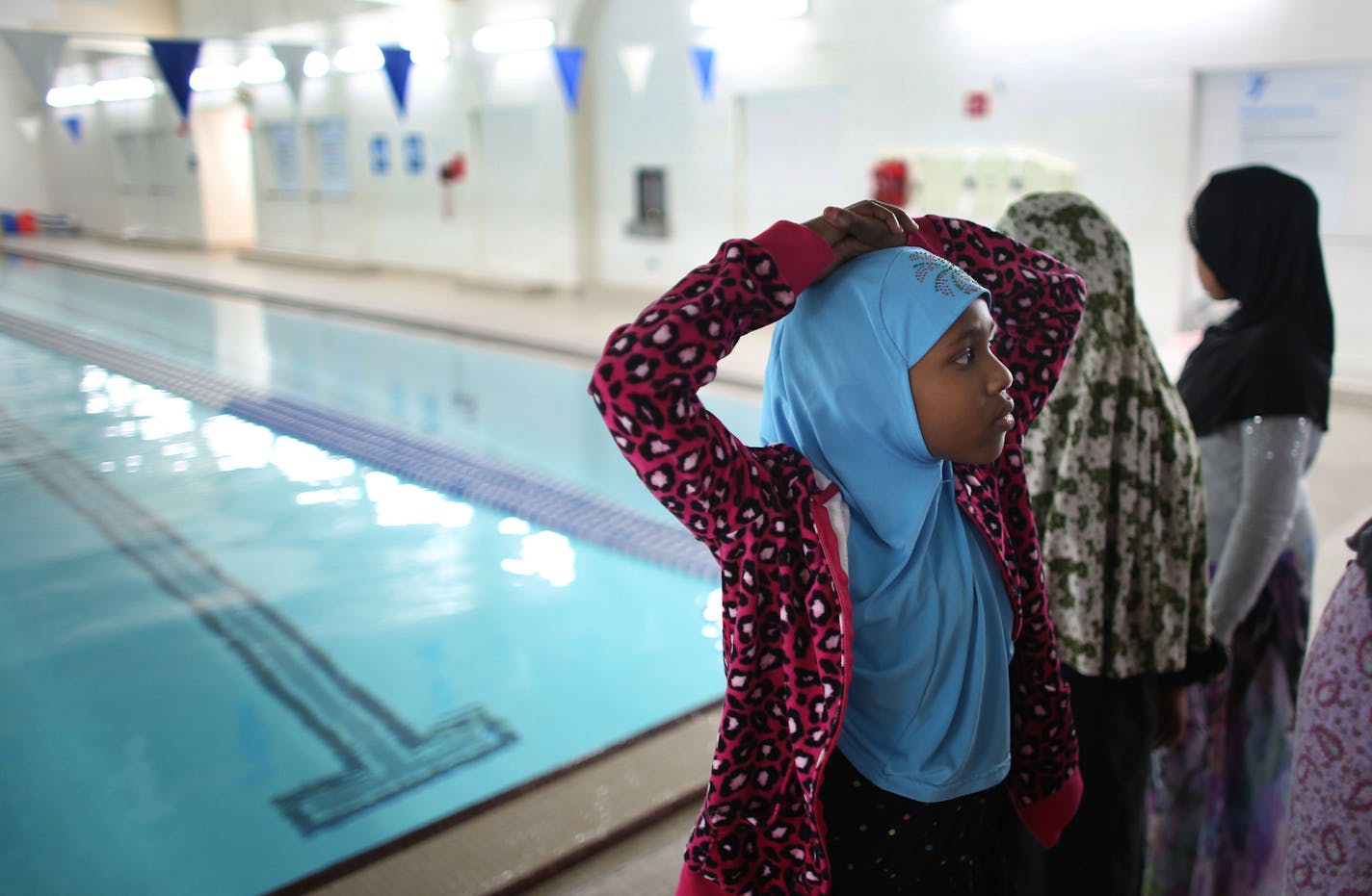 Zalma Ahmed, 7, waited for instruction before a girl's only water safety class at theYMCA in downtown St. Paul, Min., Tuesday, November 9, 2013. ] (KYNDELL HARKNESS/STAR TRIBUNE) kyndell.harkness@startribune.com