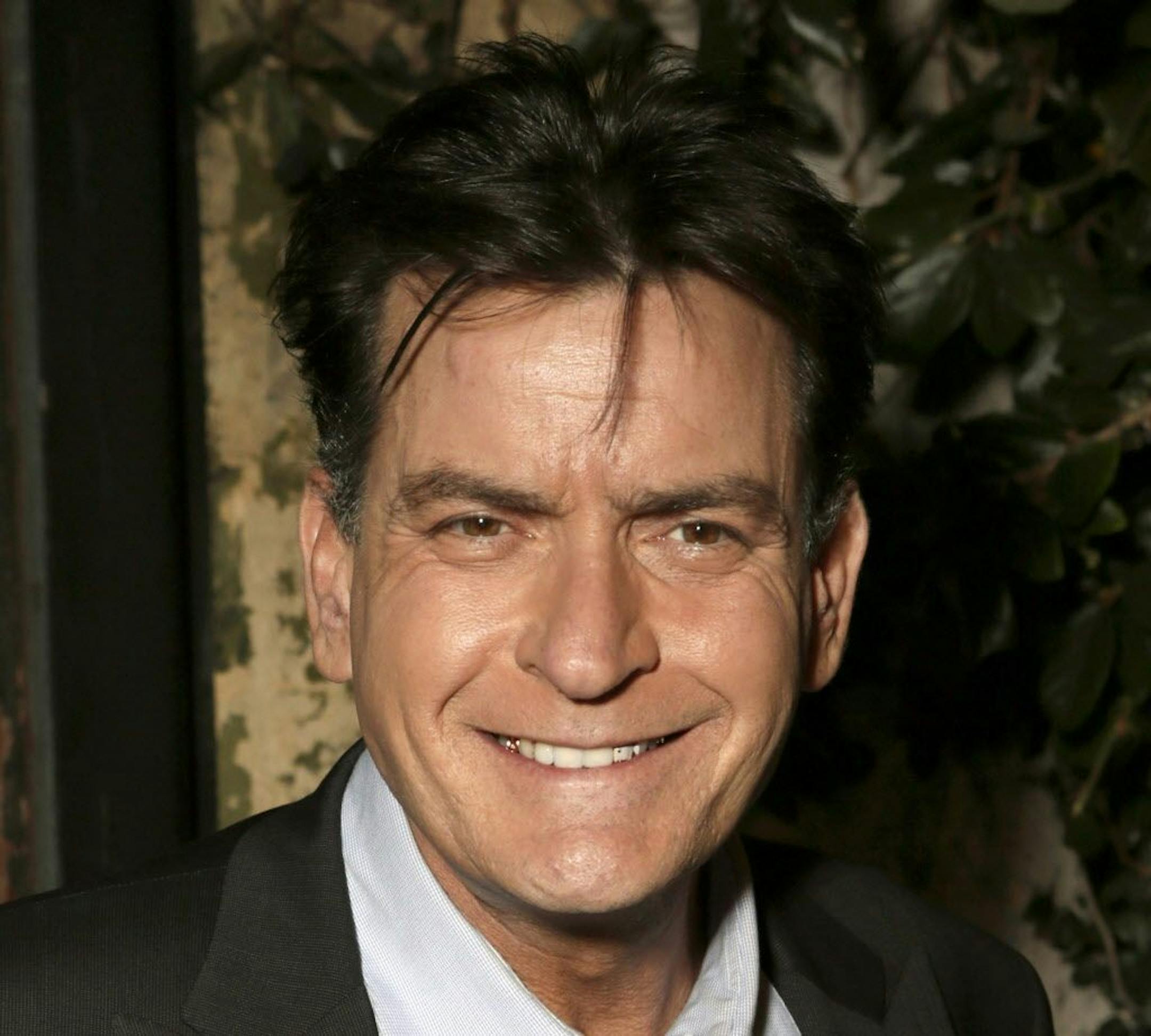 FILE - This June 26, 2012 file photo shows actor Charlie Sheen attending the FX Summer Comedies Party at Lure in Los Angeles. Sheen's FX sitcom "Anger Management" is half-way through its initial 10-episode run and poised to get an order for 90 more. Sheen told reporters Saturday, July 28, 2012, that the prospect of continuing is as "exciting as hell," and added cheerily, "I don't think 90's gonna be enough."