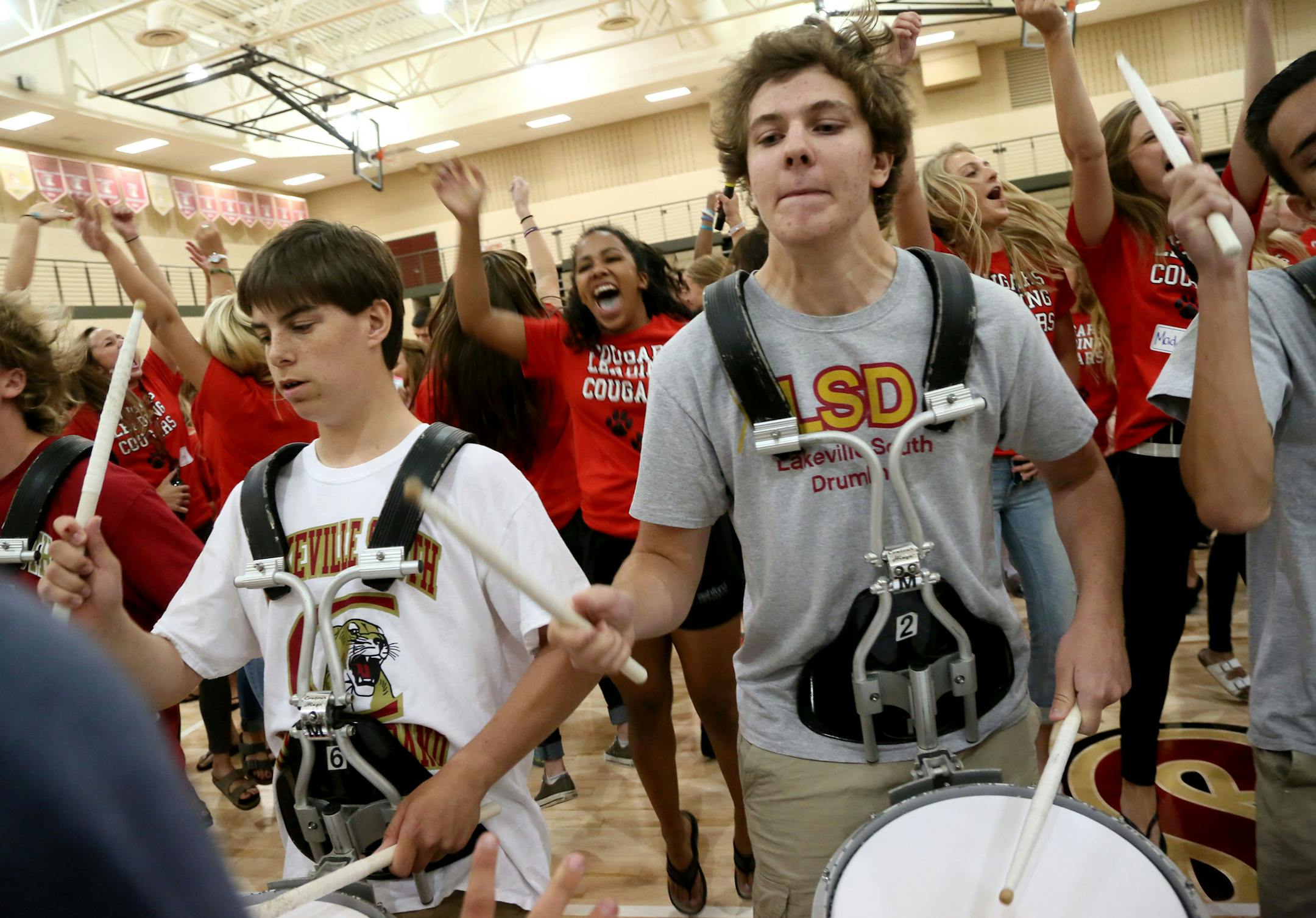Jonah Paider, senior, front right, a member of the Lakeville South High drumline, joins fellow members in beats at Pepfest for incoming freshmen in the gym at Lakeville South High Thursday, Sept. 20, 2015.](DAVID JOLES/STARTRIBUNE)djoles@startribune.com Pepfest for incoming freshmen in the gym at Lakeville South High.**Jonah Paider,cq