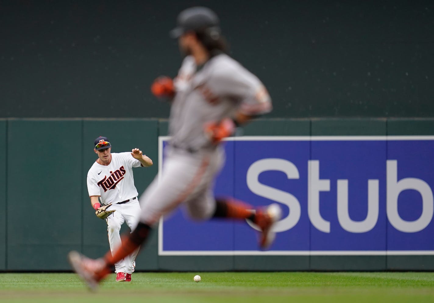 Minnesota Twins right fielder Max Kepler fields a single by San Francisco Giants' Austin Wynns (not pictured) as San Francisco Giants' Brandon Crawford advances to second base during the second inning of a baseball game Sunday, Aug. 28, 2022, in Minneapolis. (AP Photo/Abbie Parr)