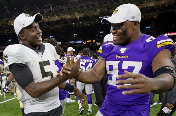 Saints quarterback Teddy Bridgewater and Minnesota Vikings Everson Griffen greeted each other after the game.