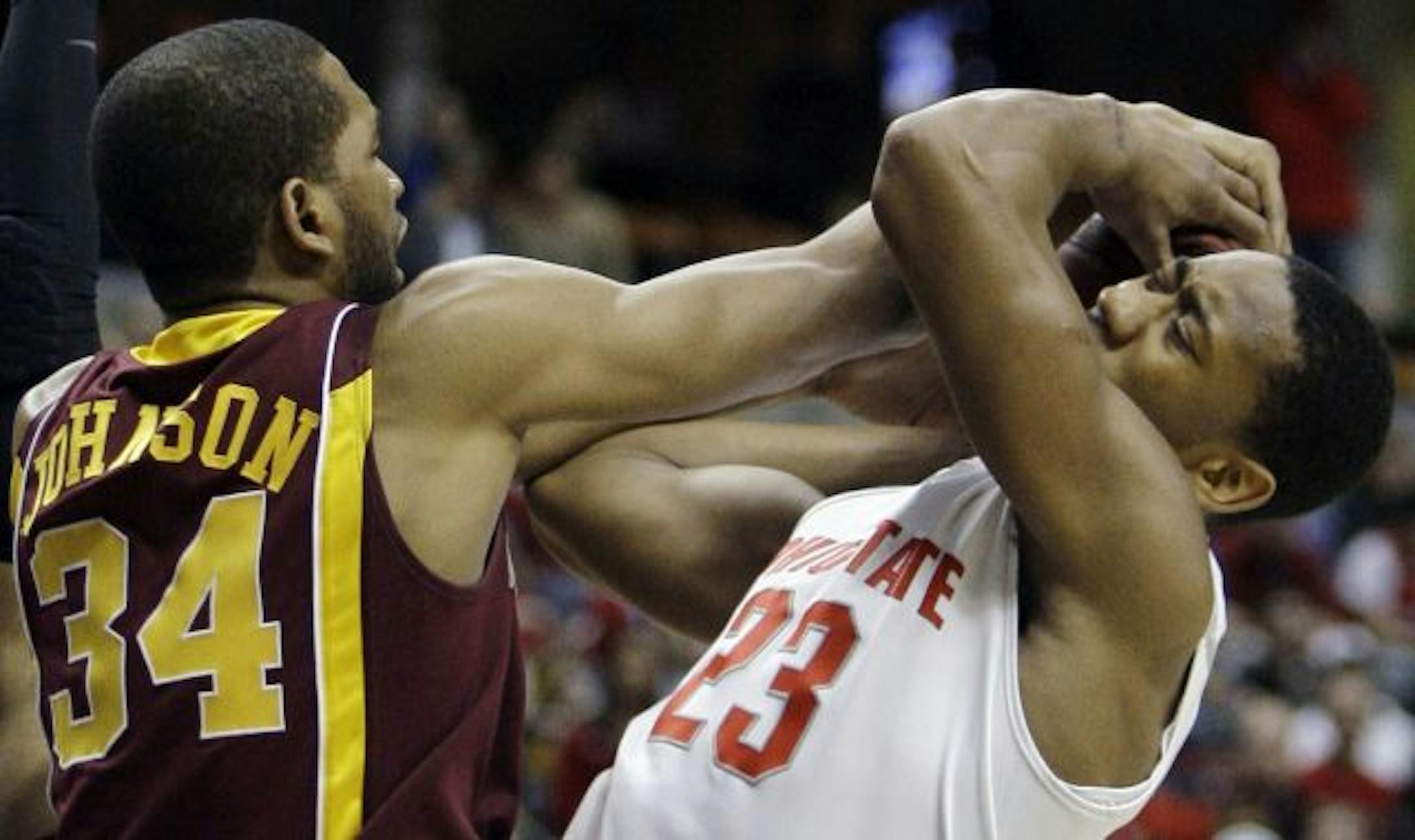 Ohio State's David Lighty (right) struggled with the Gophers' Damian Johnson for control of the ball in the first half.
