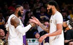 LeBron James, left, celebrates with teammate Anthony Davis during a timeout in the second hal.