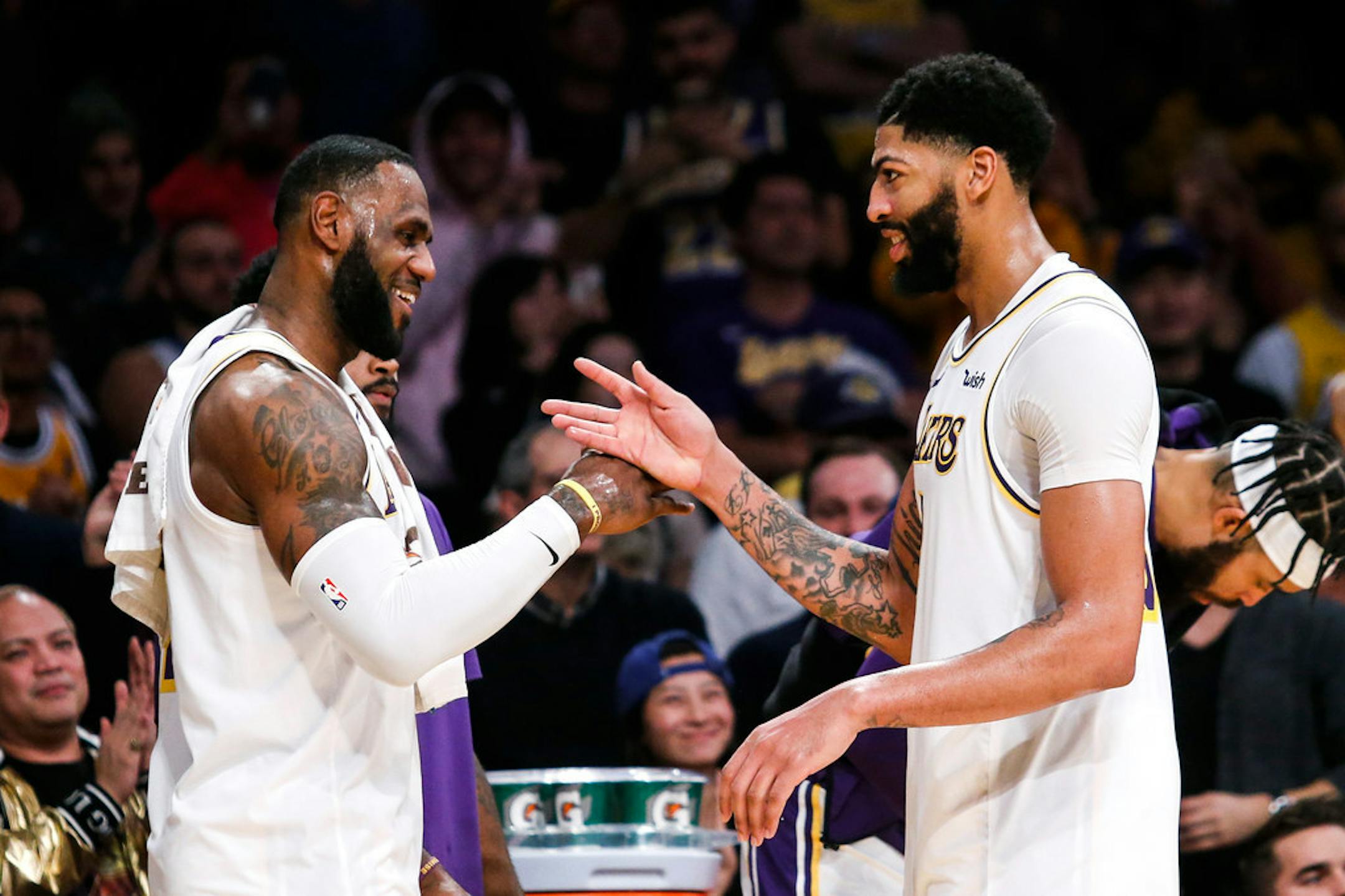 LeBron James, left, celebrates with teammate Anthony Davis during a timeout in the second hal.