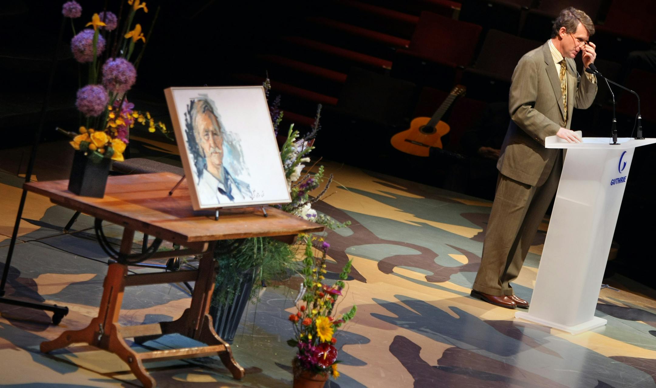 Ralph Rapson memorial service. Ralph Rapson's drafting table held flowers and a painting of the architect as his son, Rip Rapson talked about the adventures of growing up with Ralph. The memorial service for the designer of the original Guthrie Theatre took place at the thrust theatre in the new Guthrie building. Several hundred people attended the memorial.
