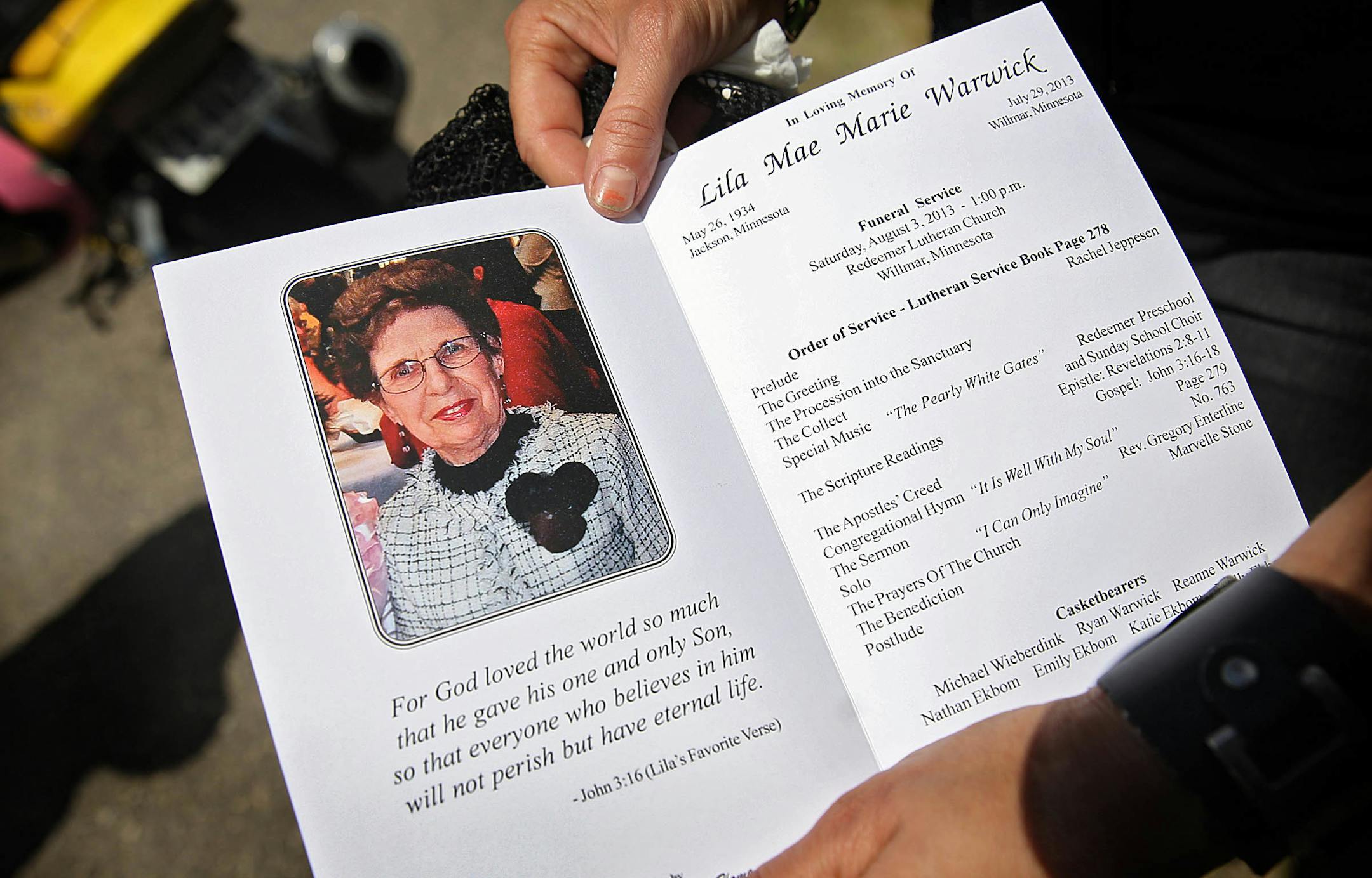 Anngel Schweiss, Bloomington, held a program from the funeral service. Schweiss said she was a friend of Lila Warwick.