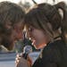 This image released by Warner Bros. shows Bradley Cooper, left, and Lady Gaga in a scene from the latest reboot of the film, "A Star is Born." (Neal P