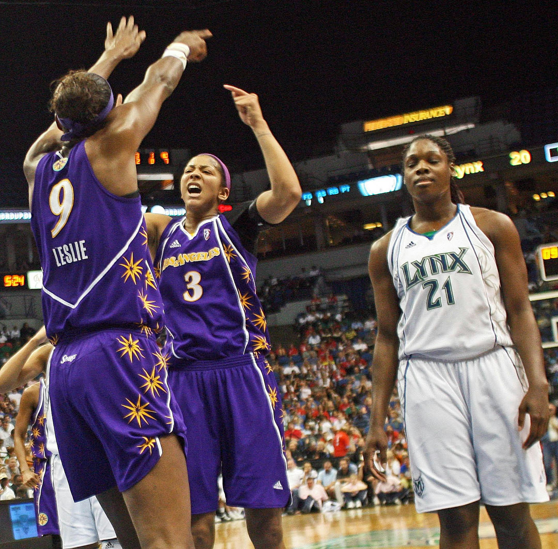 The Sparks' Lisa Leslie and Candace Parker celebrated a first-quarter basket. The Lynx's Nicky Anosike didn't share the joy.