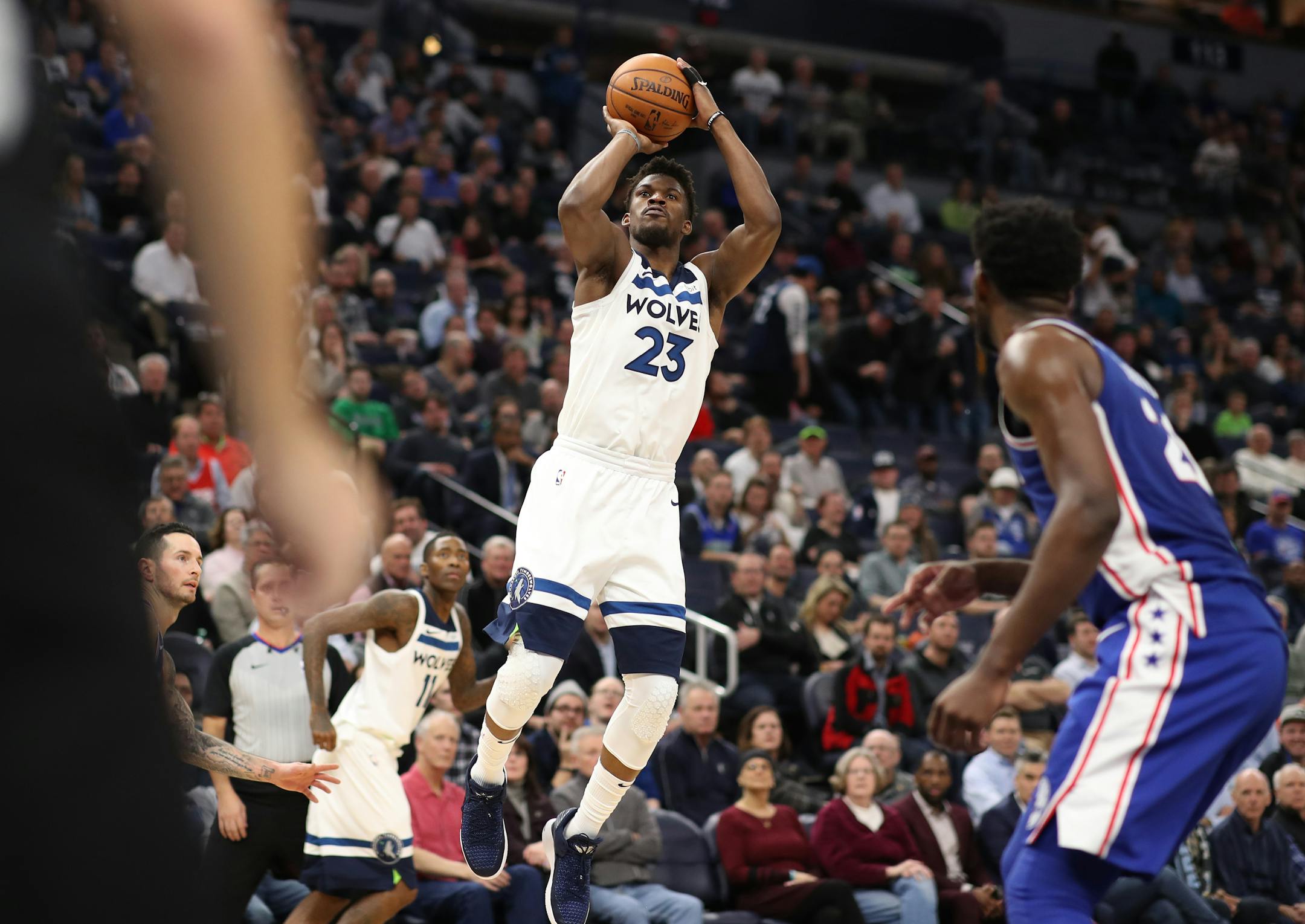 Minnesota Timberwolves guard Jimmy Butler (23) hit three point shot in the second half during NBA action at Target Center Tuesday December 12, 2017 in Minneapolis, MN.] The Minnesota Timberwolves hosted the Philadelphia 76ers at Target Center. JERRY HOLT � jerry.holt@startribune.com