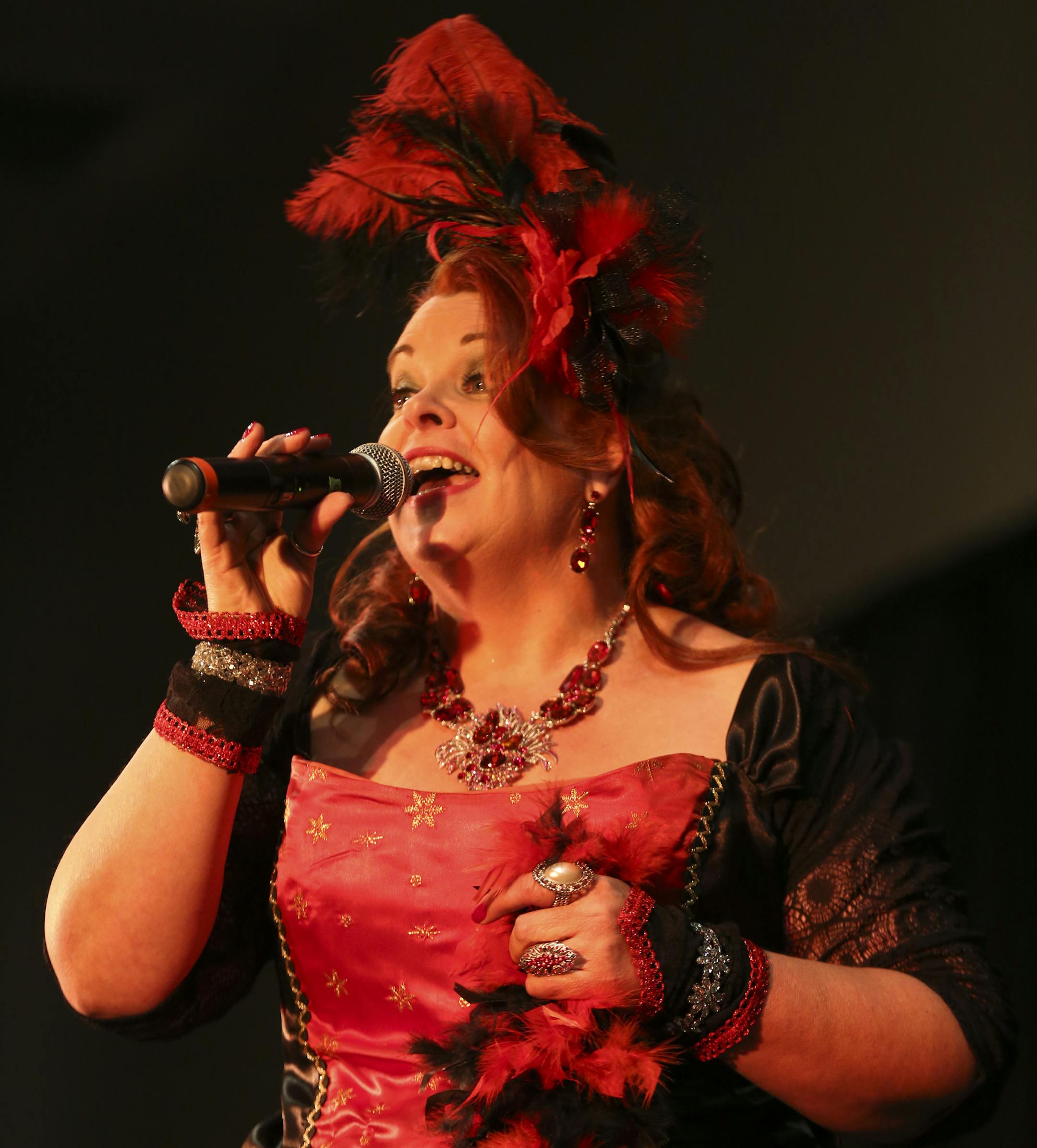 Kathy Rustin-Westphal performed as she competed during the 2014 Klondike Kate competition in Oakdale, Minn., on Wednesday, January 8, 2014. During the contest six contestants performed up to three songs and were judged on their singing abilities, song choice, costumes, crowd appeal, and their portrayal of the real-life character of Klondike Kate, a woman who struck it rich in the Gold Rush of 1898 as the most famous dance hall girl in the north and has since become a symbol of fun, frivolity and