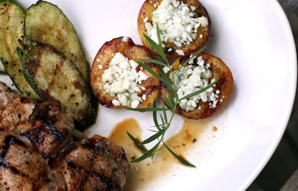 Apple and honey marinated pork chops with grilled stuffed feta peaches.