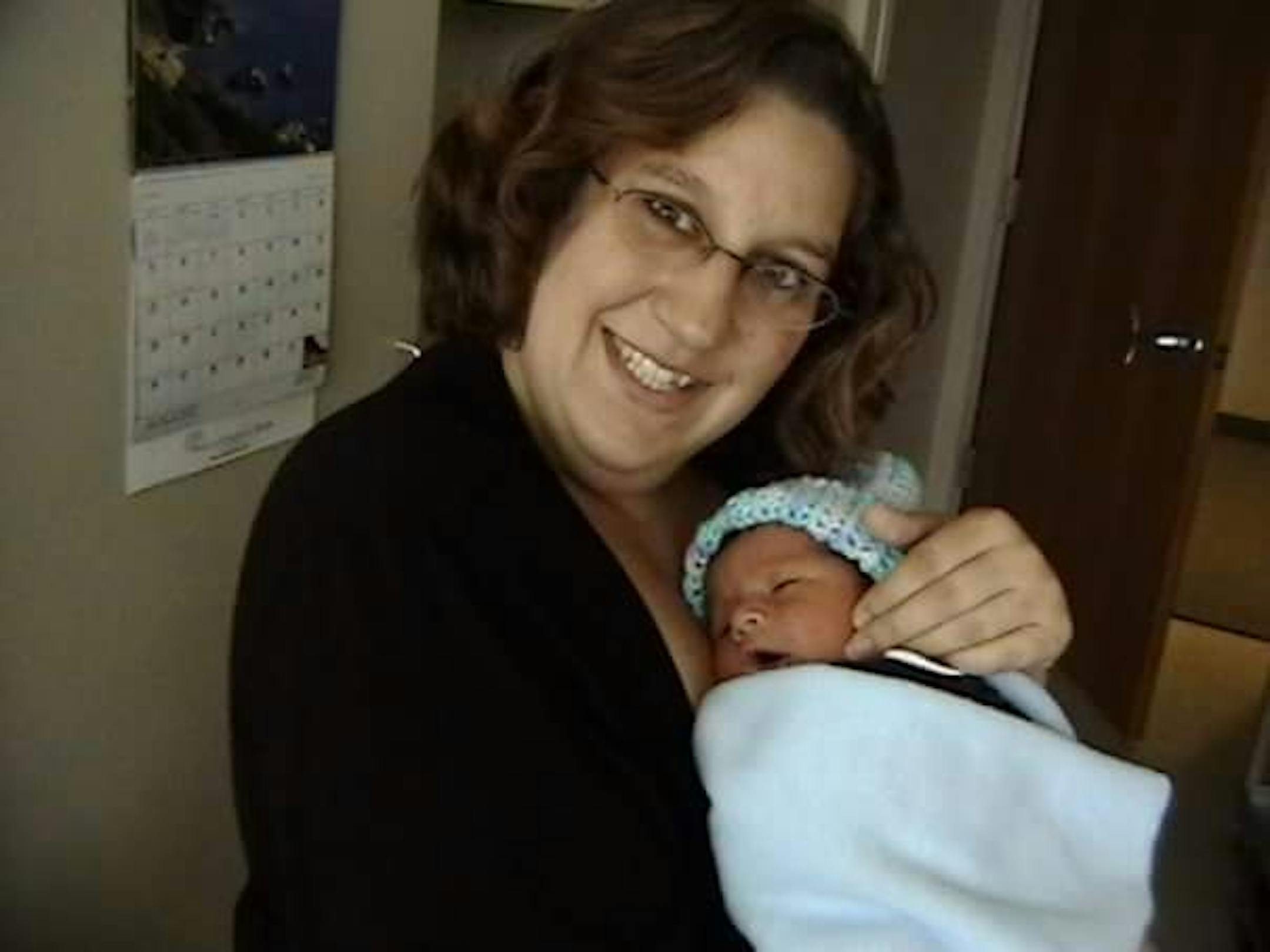 The author was photographer with her baby as they prepared to leave the hospital.