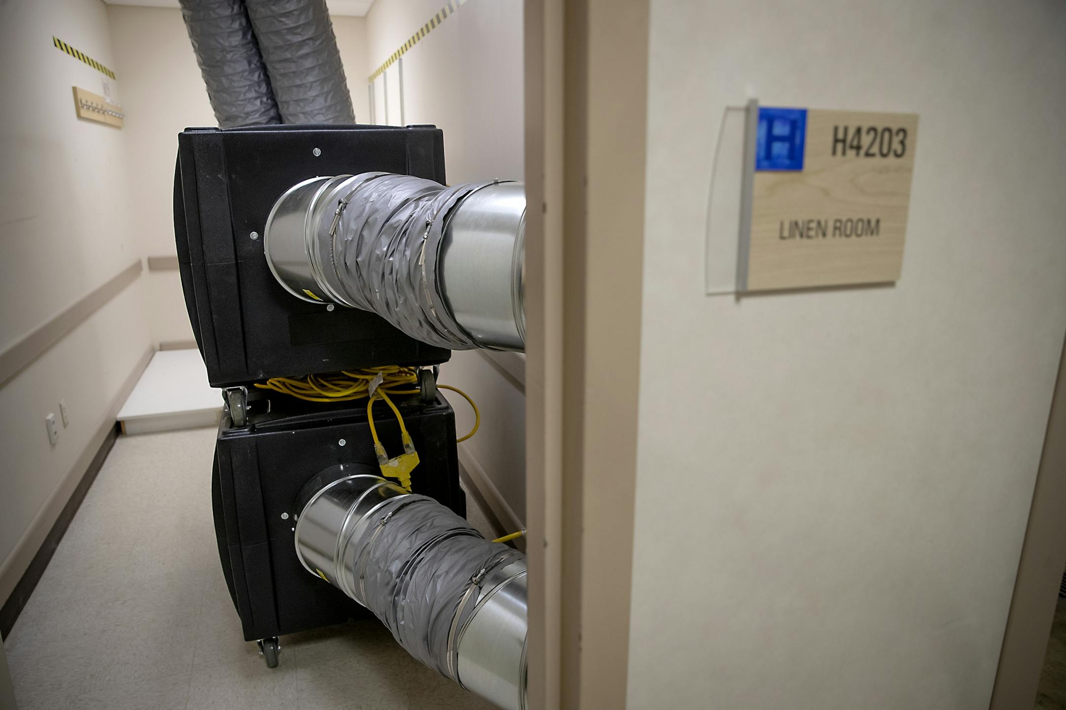 Abbott Northwestern's Director of Facilities Steve Waderich showed how a linen room has been replaced with a new "High Efficiency Filtration" air filtering system fan unit at the hospital, Tuesday, March 24, 2020 in Minneapolis, MN.