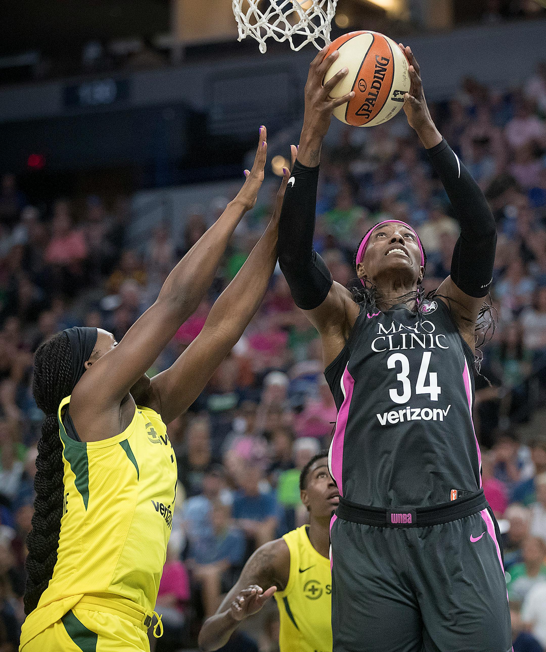 Minnesota Lynx center Sylvia Fowles took it to the net above Seattle Storm's forward Crystal Langhorne during the fourth quarter. She led the Lynx with 28 points.