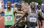 Bernard Lagat, right, wins in the finals of the men's 5000-meter run at the U.S. Olympic Track and Field Trials, Saturday, July 9, 2016, in Eugene Ore