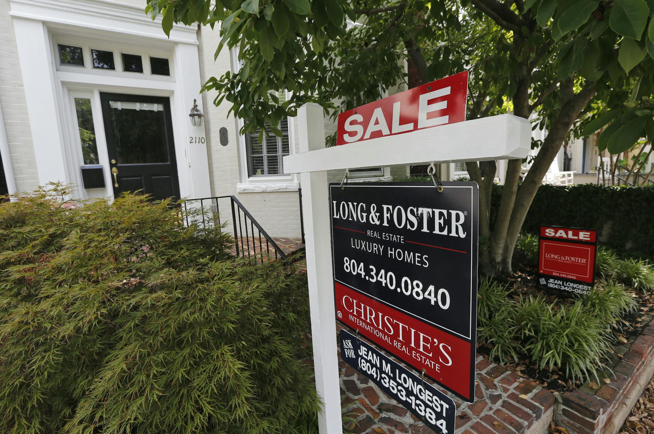 In this Aug. 16, 2019, photo a for sale signs beckon buyers to homes along Park Avenue in Richmond, Va. On Tuesday, Aug. 27, the Standard & Poor's/Case-Shiller 20-city home price index for June is released. (AP Photo/Steve Helber)