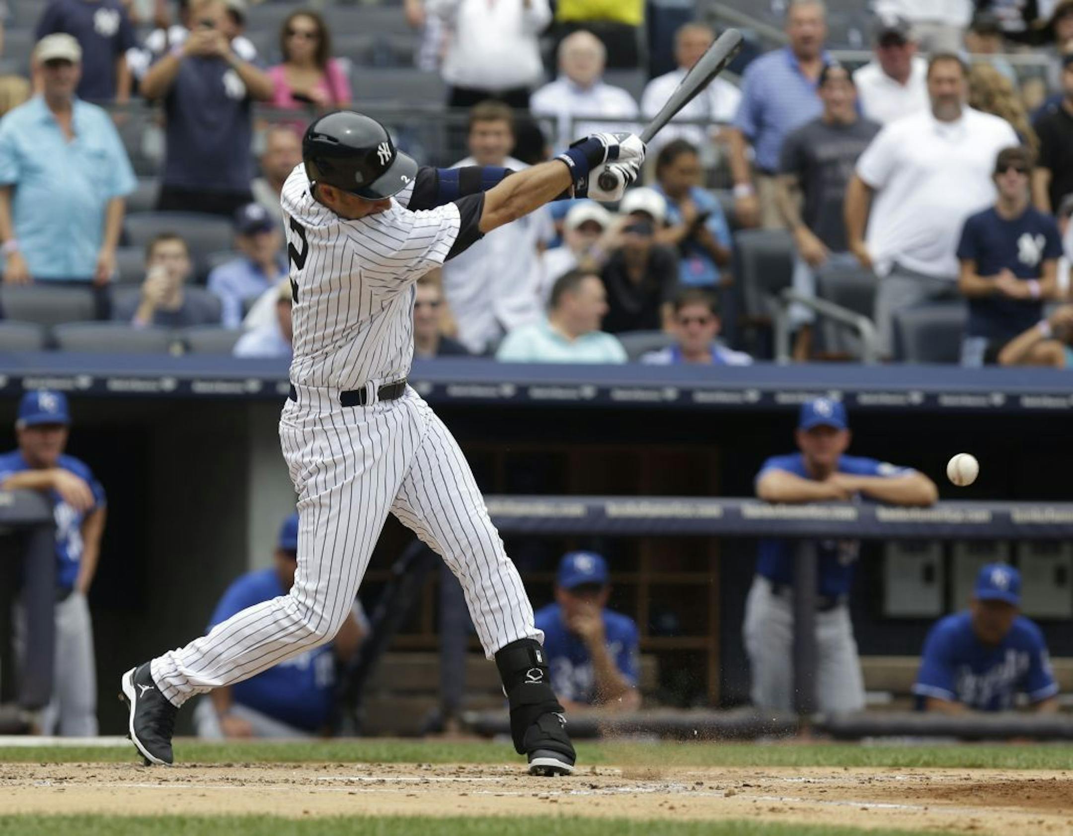 New York Yankees' Derek Jeter singles during the first inning of the baseball game against the Kansas City Royals at Yankee Stadium Thursday, July 11, 2013 in New York.
