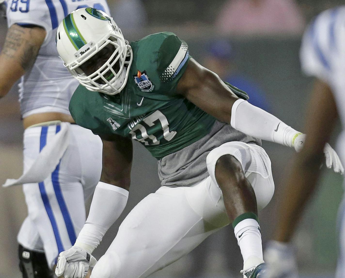 Tulane defensive end Ade Aruna (87) celebrates as Duke tight end Braxton Deaver (89) walks off the field after Tulane recovered a fumble in the first half of an NCAA college football game in New Orleans, Thursday, Sept. 3, 2015. (AP Photo/Gerald Herbert) ORG XMIT: LAGH105