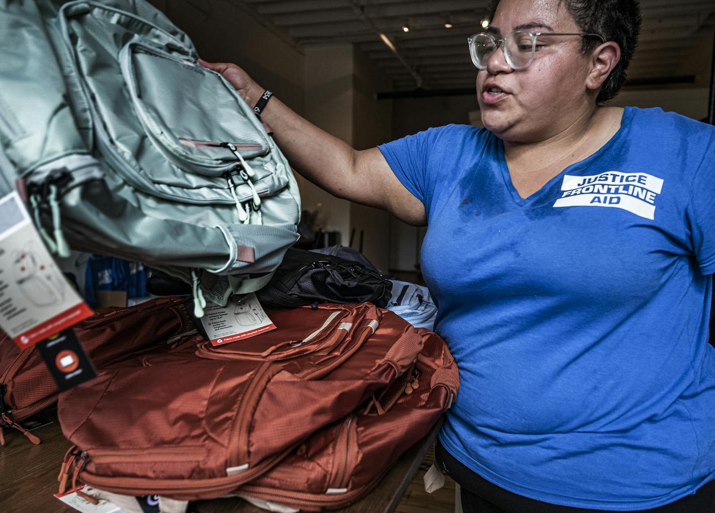 Deshann Sanchez who founded Justice Frontline Aid got some backpacks ready as she prepares to head out to Kenosha, Wis., to join the protests there. The backpacks donated or purchased with donations will be used for first aid kits.