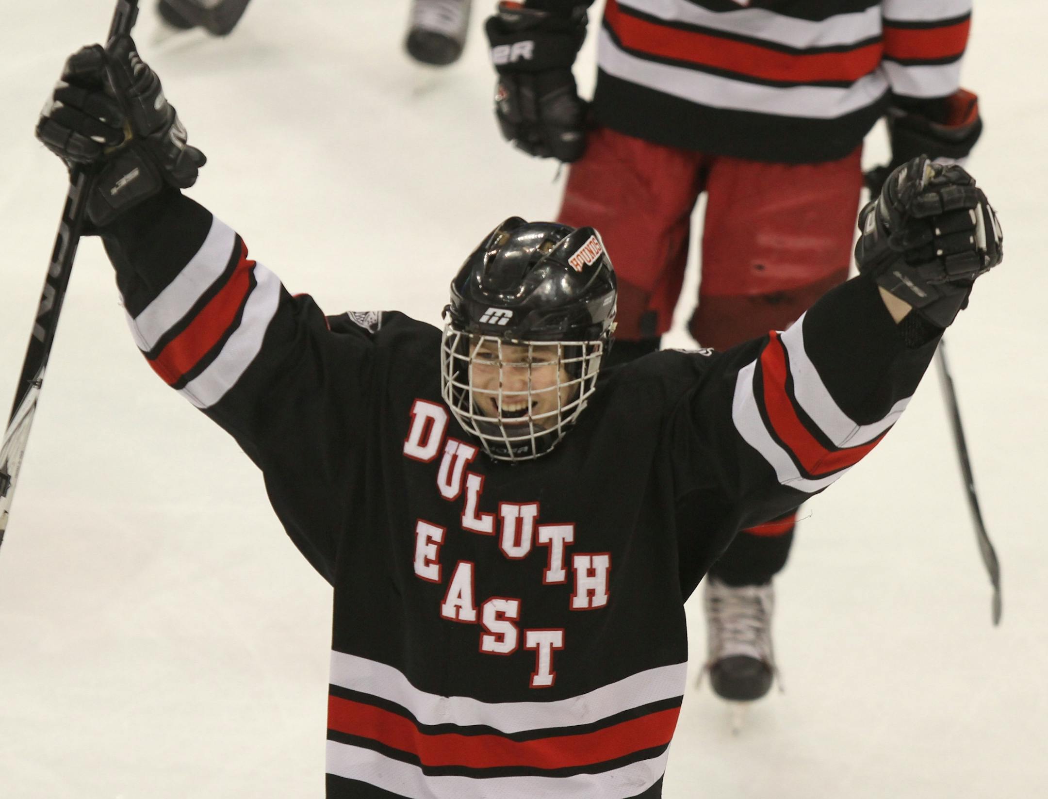Boys Hockey Tournament Class 2A Final, Eden Prairie vs Duluth East. (left to right) Duluth East's Trevor Olson celebrated his goal against the Eagles.
