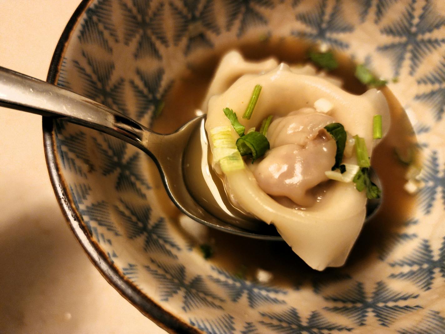 Golden chicken broth and pork wonton from Saturday Dumpling Co.