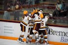 Teammates celebrated Gophers forward Taylor Heise (9) scoring in the third period during a game earlier this season.