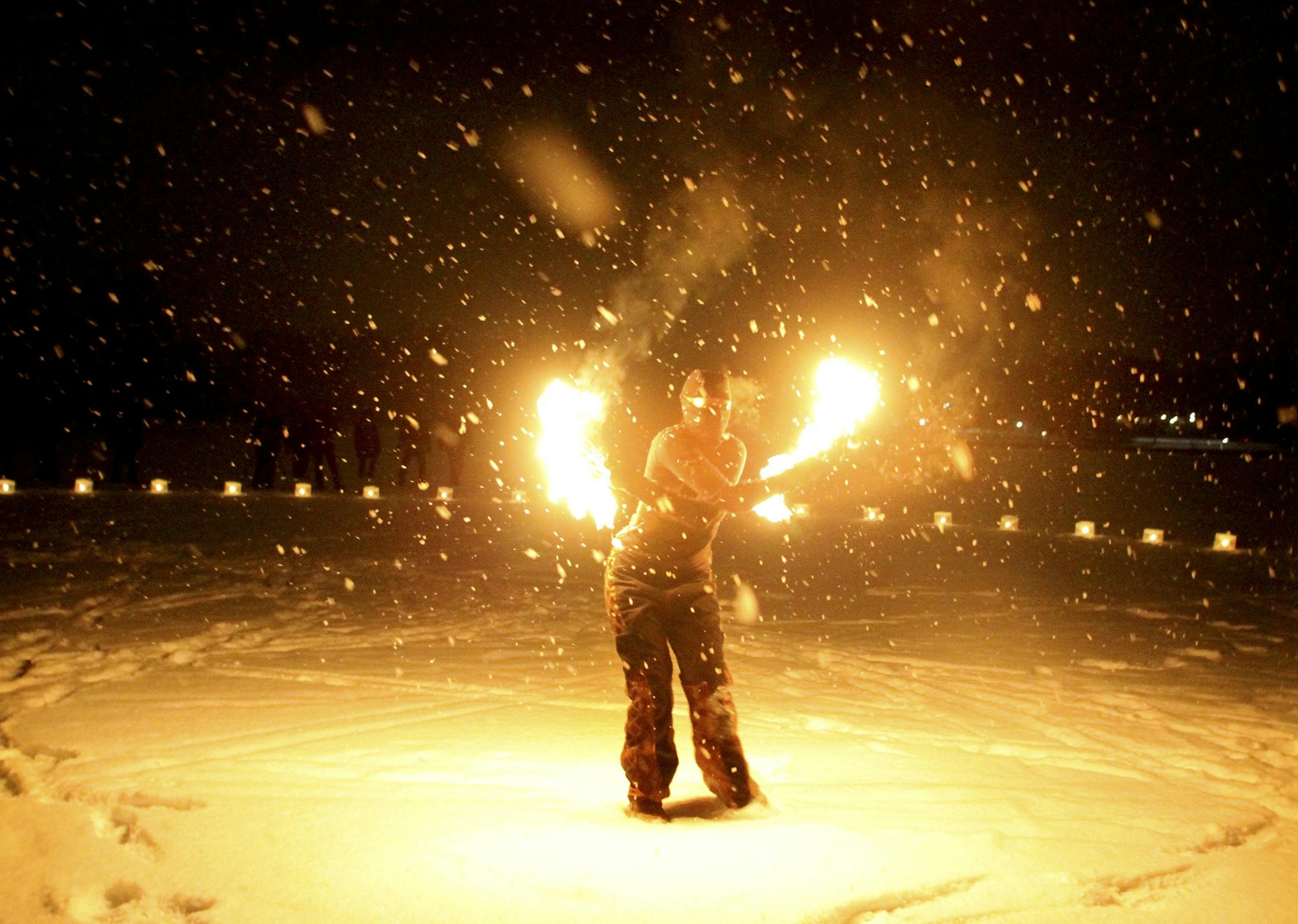 Embrace the Light performer Star Williams used fire to entertain crowds of skiers. The Park Nicollet Luminary Loppet took place on Lake of the Isles on Febuary 2, 2013.