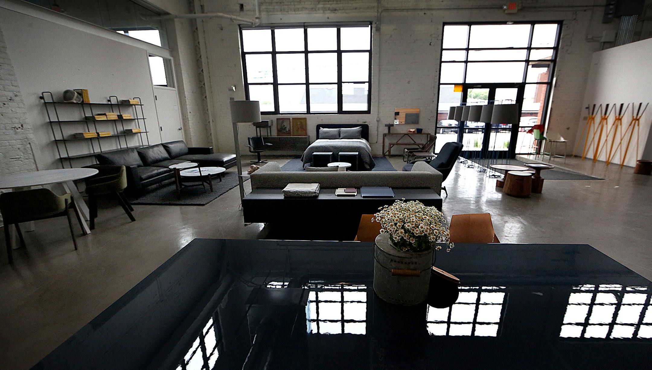 Natural light streams through large windows at the Blu Dot outlet store in Minneapolis. ] JIM GEHRZ ï james.gehrz@startribune.com / Minneapolis, MN / July 16, 2015 / 11:00 AM ñ BACKGROUND INFORMATION: Local modern furniture manufacturer Blu Dot opens its first outlet store. The Minneapolis store will feature discounted items as well as most of the full-priced line. Co-founder John Christakos talks about his company's growth.