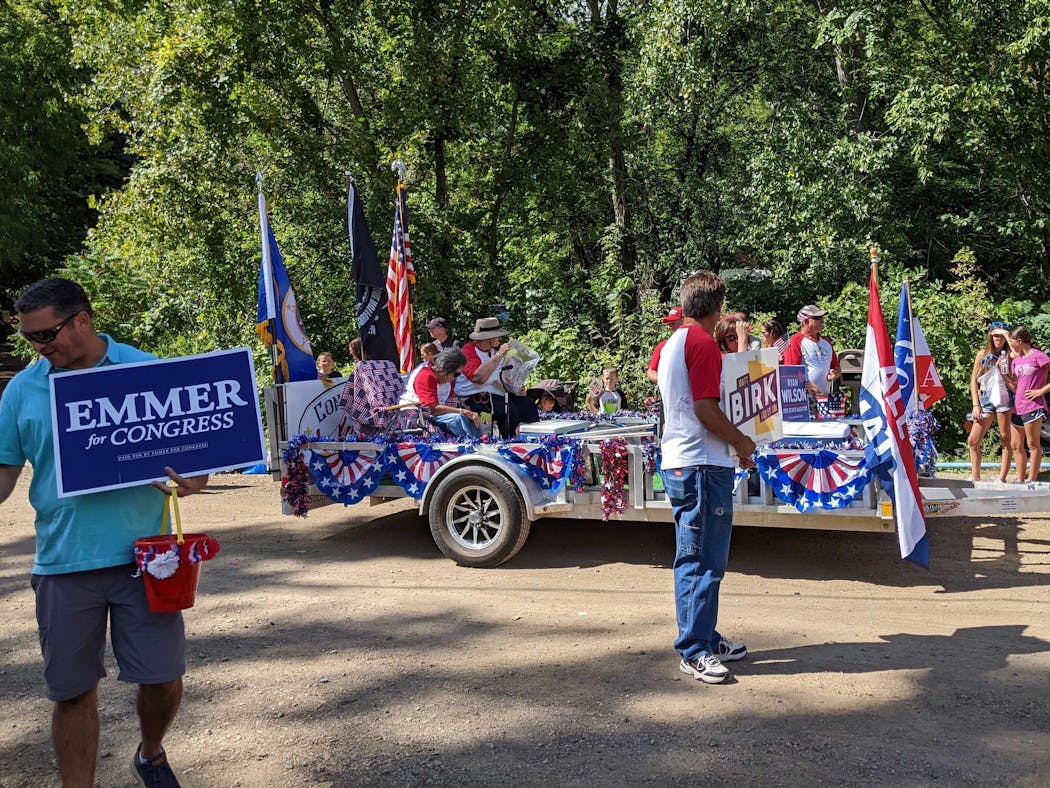 Volunteers for Emmer and other GOP candidates walk the Steamboat Days parade route. 