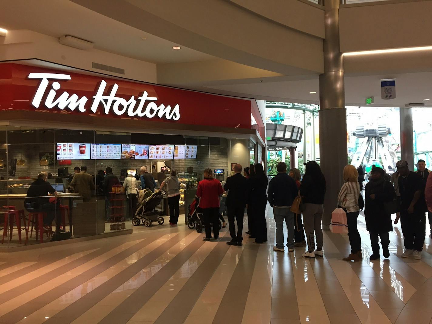 A line of customers goes out the door during the soft opening of the new Tim Hortons bakery at Mall of America, Nov. 15, 2016.