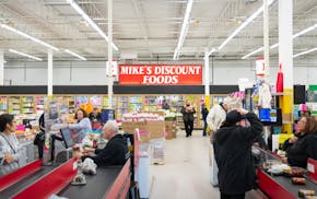 Shoppers scoop up deals at Mike’s Discount Foods in Fridley, which sells heavily discounted items ranging from produce and cereal close to their “
