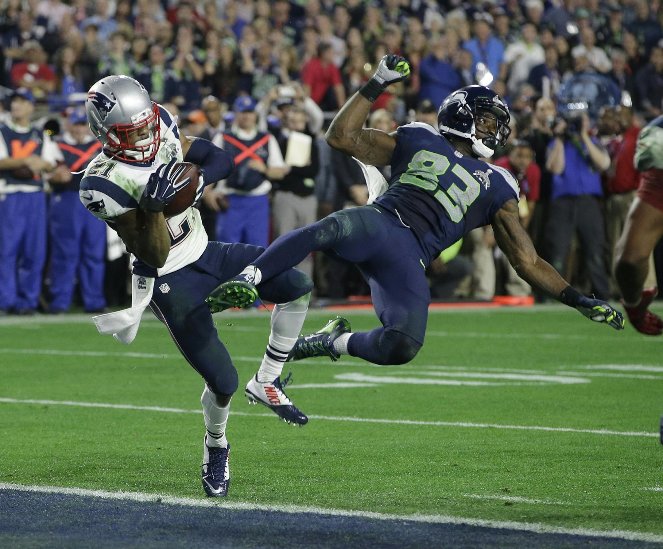 New England Patriots strong safety Malcolm Butler (21) intercepts a pass intended for Seattle Seahawks wide receiver Ricardo Lockette (83) during the second half of NFL Super Bowl XLIX football game Sunday, Feb. 1, 2015, in Glendale, Ariz.