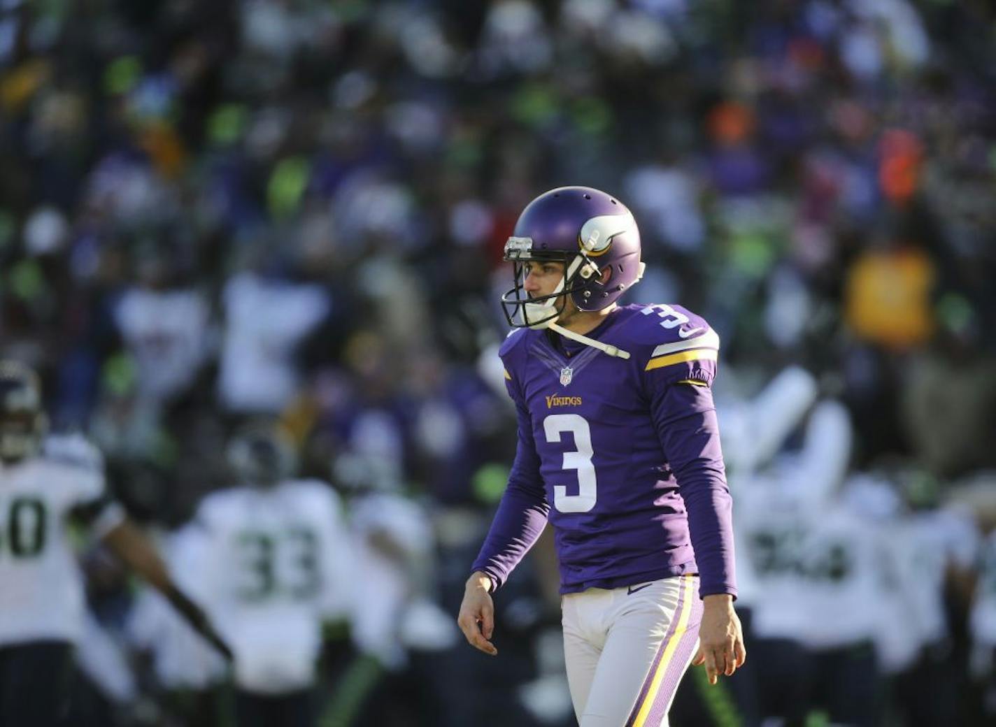 Vikings kicker Blair Walsh walked away after his chance for a game winning 27 yard field goal sailed wide left at the end of the fourth quarter and the Seattle players began celebrating.