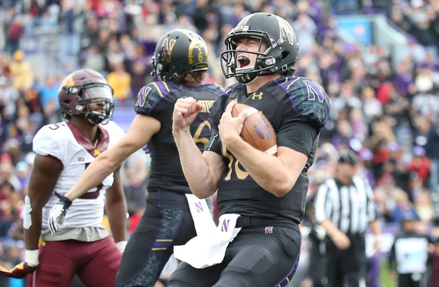 Northwestern quarterback Clayton Thorson celebrated after running the ball for a touchdown against Minnesota in Evanston, Ill.