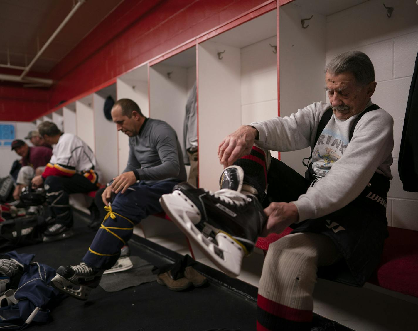 Mark Sertich got his skates on before his morning hockey game Thursday. ] JEFF WHEELER &#x2022; jeff.wheeler@startribune.com On the same morning that 97 year-old Mark Sertich was to be honored with induction into the Duluth Entertainment Convention Center's Athletic Hall of Fame, he took part in a his regular morning hockey game Thursday, May 16, 2019 at the Essentia Duluth Heritage Center. Sertich plays three mornings a week, even though recovering from a fall he took last year.