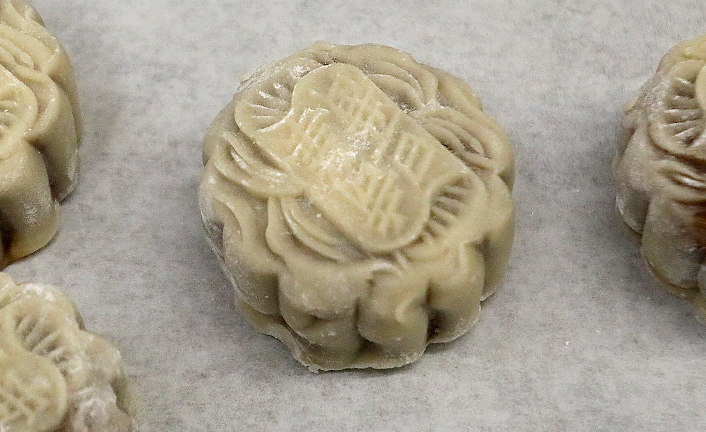 Pauline Kwan made mooncakes ahead of the lunar calendar harvest holiday that begins on Monday. Mooncakes are a specialty at the Mid-Autumn Festival and this is one of the only places in the Twin Cities where they are made. Here, mooncakes ready for the oven and seen Wednesday, Sept. 18, 2018, in Minneapolis, MN.] DAVID JOLES &#xef; david.joles@startribune.com Michelle Kwan is taking over the running of Keefer Court Bakery and Cafe from her parents. Her father was known as the fortune cookie king